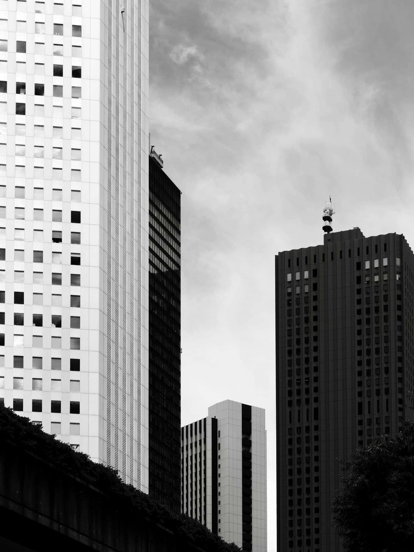 Office towers against a cloudy sky